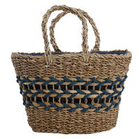 Beige wicker bag with blue thread on the handle product image