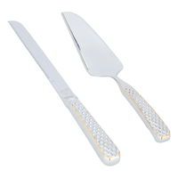 A set of silver engraved cake serving spoons with a golden font, 2 pieces product image