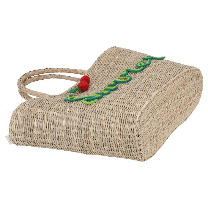 Beige wicker bag red fruit with a hand image 2