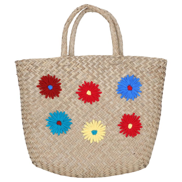 Beige wicker bag with colorful patterns in hand image 1