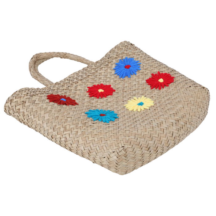 Beige wicker bag with colorful patterns in hand image 2