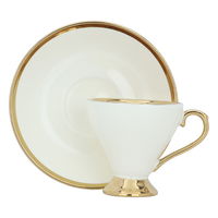 A set of gilded cream ceramic coffee cups and saucers, 12 pieces product image