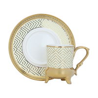 A set of cream and gold ceramic coffee cups and saucers, 12 pieces product image