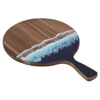 A circular dessert serving board with a sea wave engraving on its hand product image