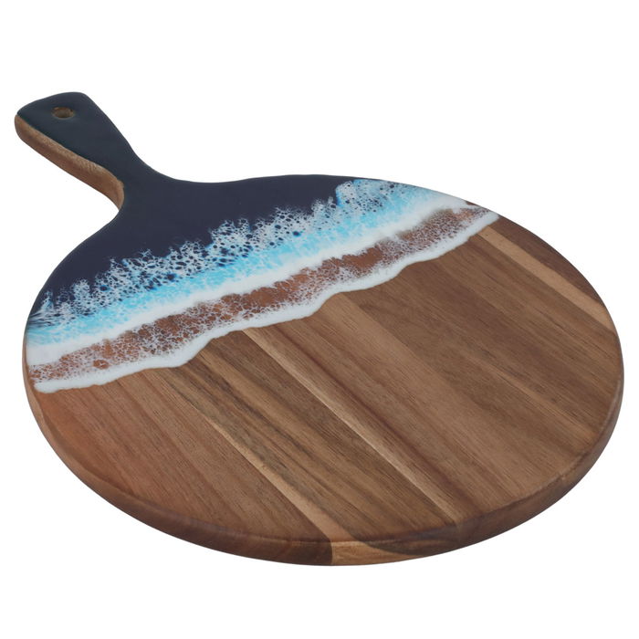 A circular dessert serving board with a sea wave engraving on its hand image 2