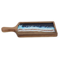 A rectangular dessert serving board with a sea wave pattern on its hand product image