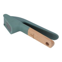 Green silicone manual garlic press with wooden handle product image