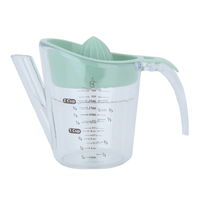 Green measuring cup with juicer product image